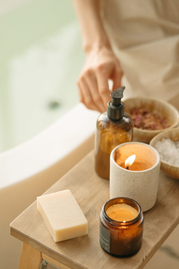Calm spa setting with lit candles and bath products for a soothing atmosphere.